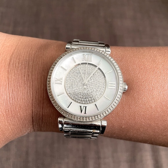 Michael Kors women’s watch with diamonds and mother of pearl face plate